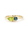 Custom Yellow Gold Toi et Moi Ring with Peridot & Spinel, made in Montreal – A modern engagement ring featuring a vibrant pear-cut peridot and a deep blue spinel, handcrafted by Bena Jewelry.