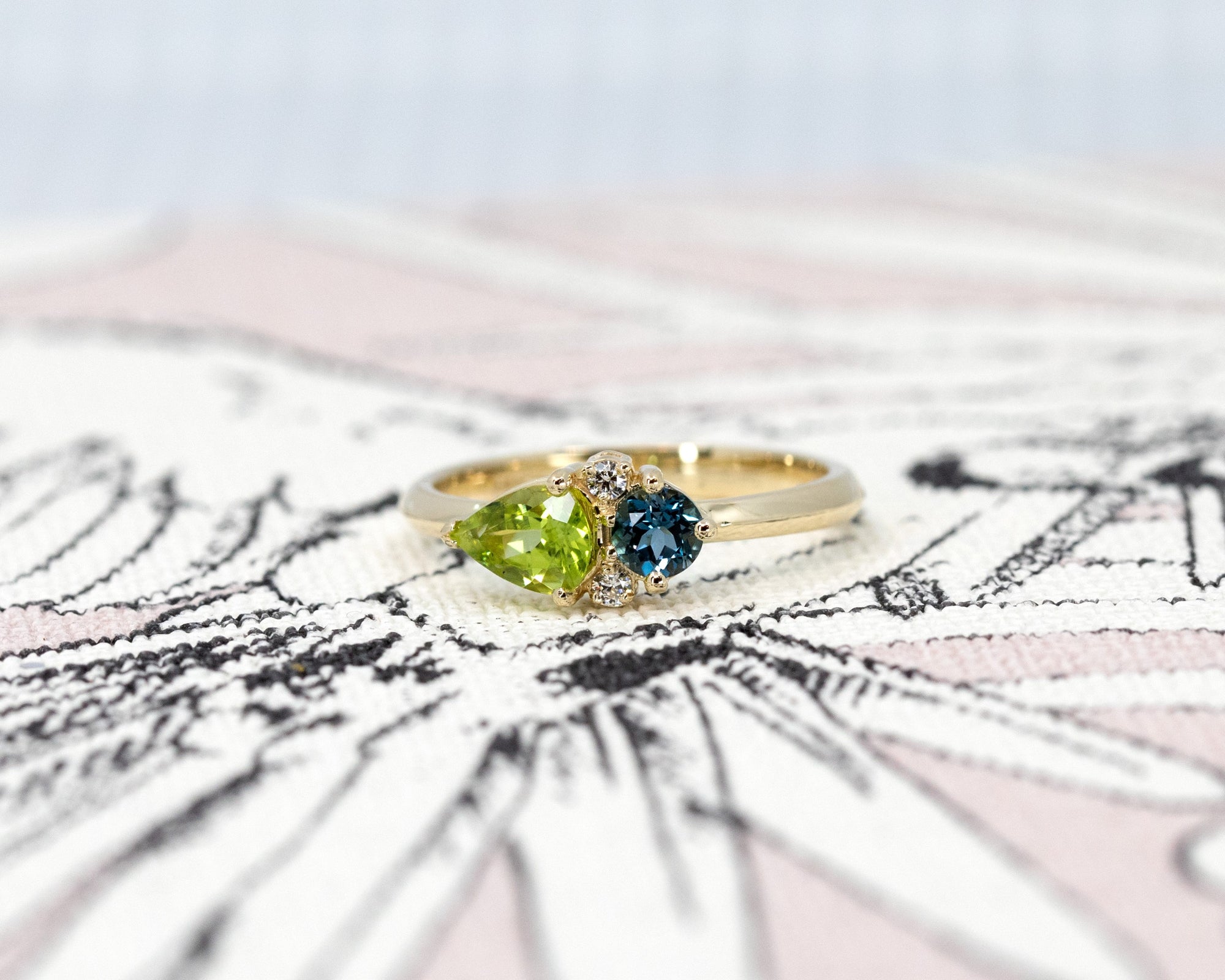 Close-up of the Peridot and Spinel Ring by Bena Jewelry – This bespoke ring showcases a contemporary setting with a harmonious mix of colored gemstones and diamonds.