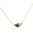 Asymmetrical Spinel & Diamond Pendant on a white background – A unique fine jewelry piece with an electric gray spinel and scattered round diamonds.