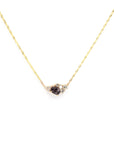 Detailed shot of the pendant with natural lighting – The play of light enhances the electric hues of the spinel and the brilliance of the diamonds.