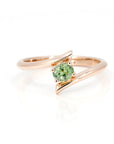 oval sahpe demantoid garnet gemstone rose gold twist bena jewelry ring made in montreal on white background