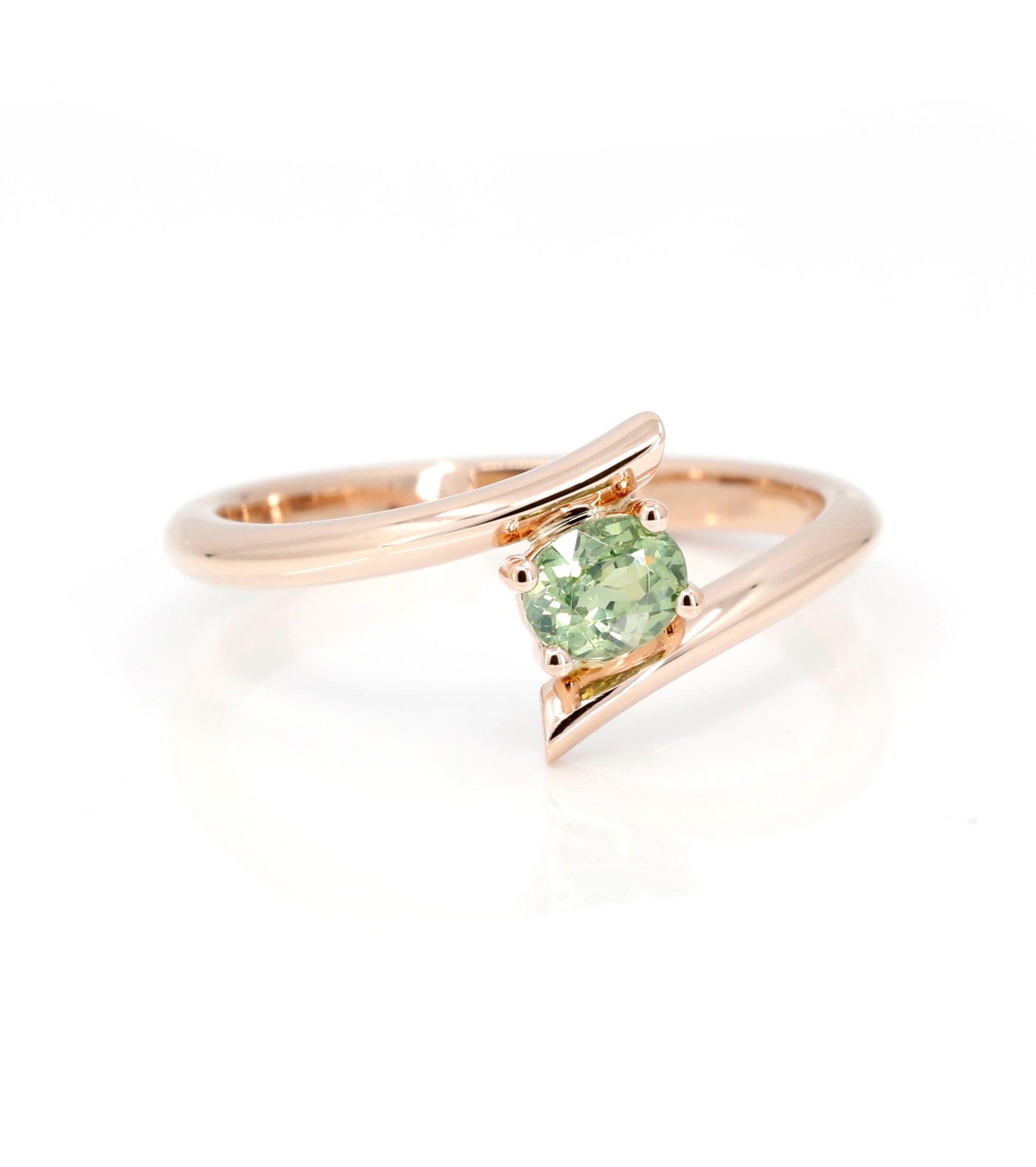 oval shape demantoid garnet ring custom made in montreal by bena jewelry on white background