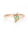 oval shape demantoid garnet ring custom made in montreal by bena jewelry on white background