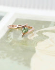 bena jewelry custom made bridal ring montreal with green gemstone demantoid garnet on multi color background