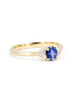 Close-up of the blue sapphire Desir Ring in yellow gold, featuring a classic design with brilliant-cut diamonds. Made in Canada by Bena Jewelry.