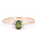 Désir Baguette Green Sapphire Ring in rose gold featuring a deep green sapphire and diamond accents by Bena Jewelry photographed on a clean white background custom-made in Montreal