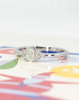 Close-up of the white gold pear diamond engagement ring, showcasing its delicate and timeless design.