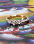 Lile diamond ring by Bena Jewelry displayed on soft pink background – handmade rose gold engagement ring with lab-grown diamonds, designed in Montreal, Canada.