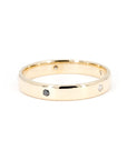 Minimalist yellow gold wedding band with round-cut diamonds, crafted by Bena Jewelry in Canada for a modern groom.