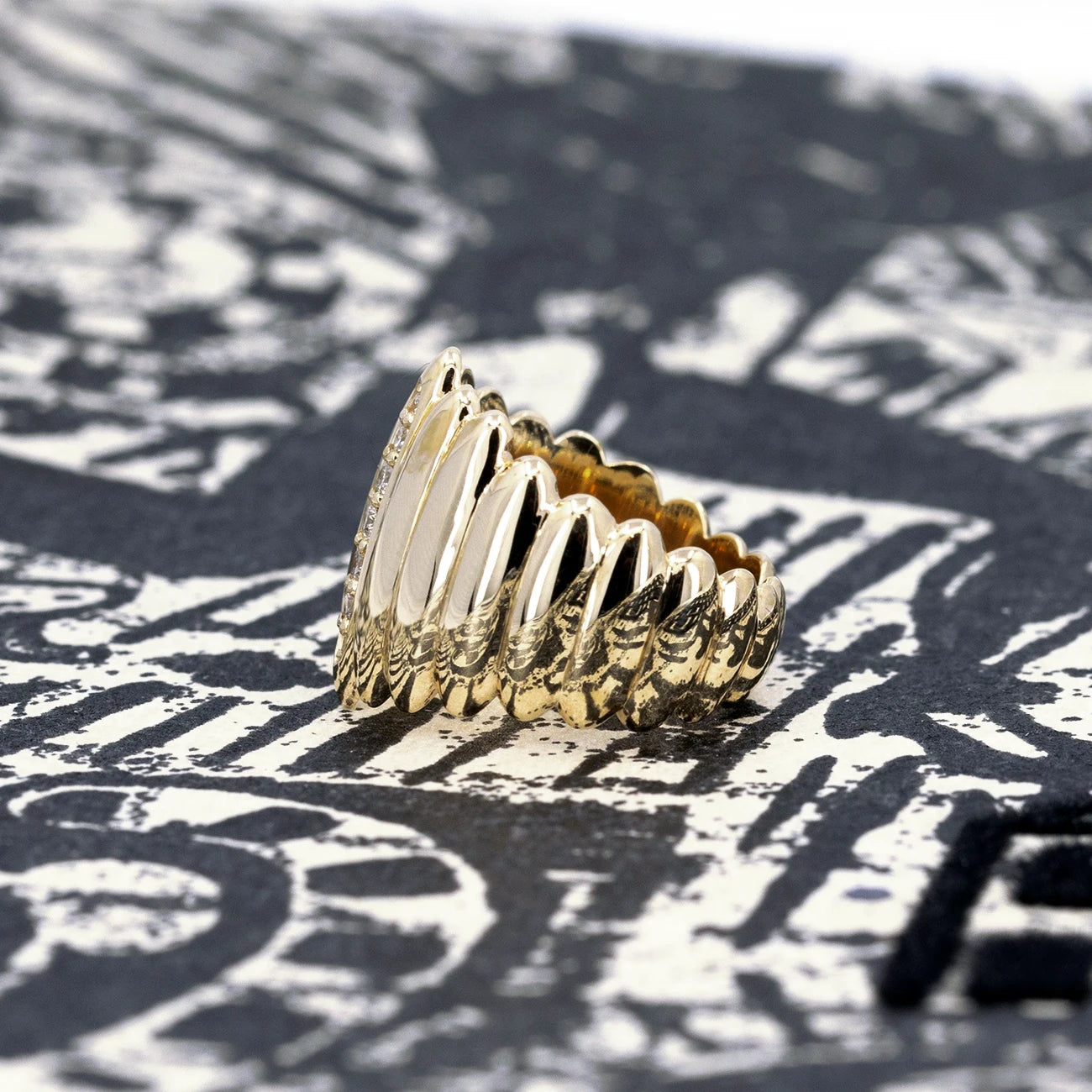 Side view of the yellow gold ring made by an independent Canadian jewelry designer, made with extra brilliant diamonds this edgy and unisex ring is made in Canada by Bena Jewelry specialist in contemporary fine jewelry. This unique creation is available for sale at Montreal's finest jewelry store Ruby Mardi.