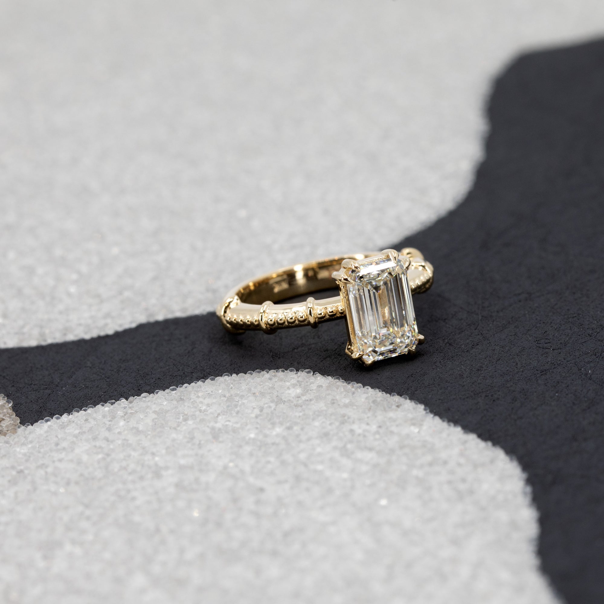 This stunning emerald shape diamond custom made engagement ring, made by Bena Jewelry in Montreal.