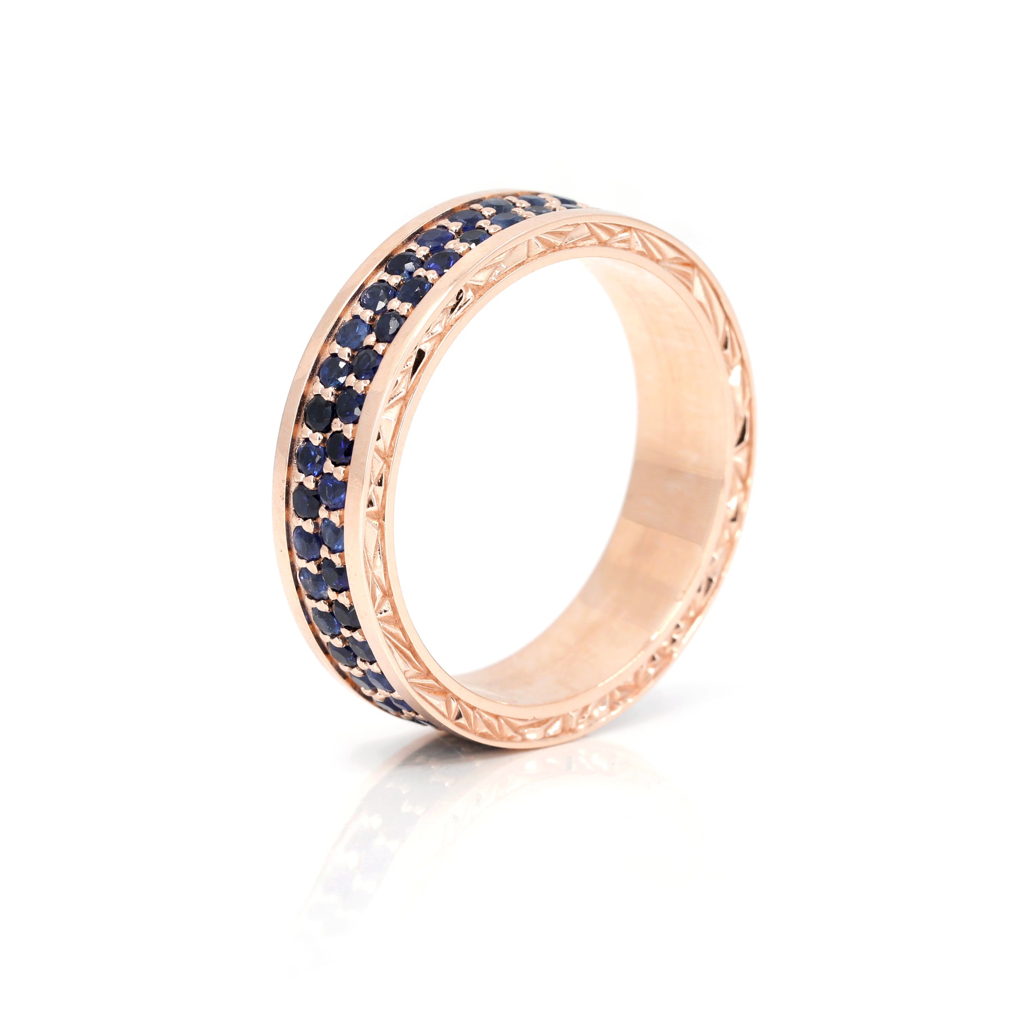 Side view of Chiseled rose gold band with blue sapphire pavé, men’s wedding ring, fine jewelry designed by Bena Jewelry in Canada.