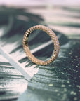 Modern and bold 14K yellow gold wedding band with two rows of dazzling diamonds, styled by Bena Jewelry. Handmade in Montreal, Quebec, this luxurious piece is perfect for women who value timeless fine jewelry made in Canada.