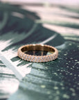 A classic wedding band in 14K yellow gold with two rows of 1.50 mm diamonds. This elegant design showcases the brilliance and timeless sophistication of Bena Jewelry's craftsmanship.