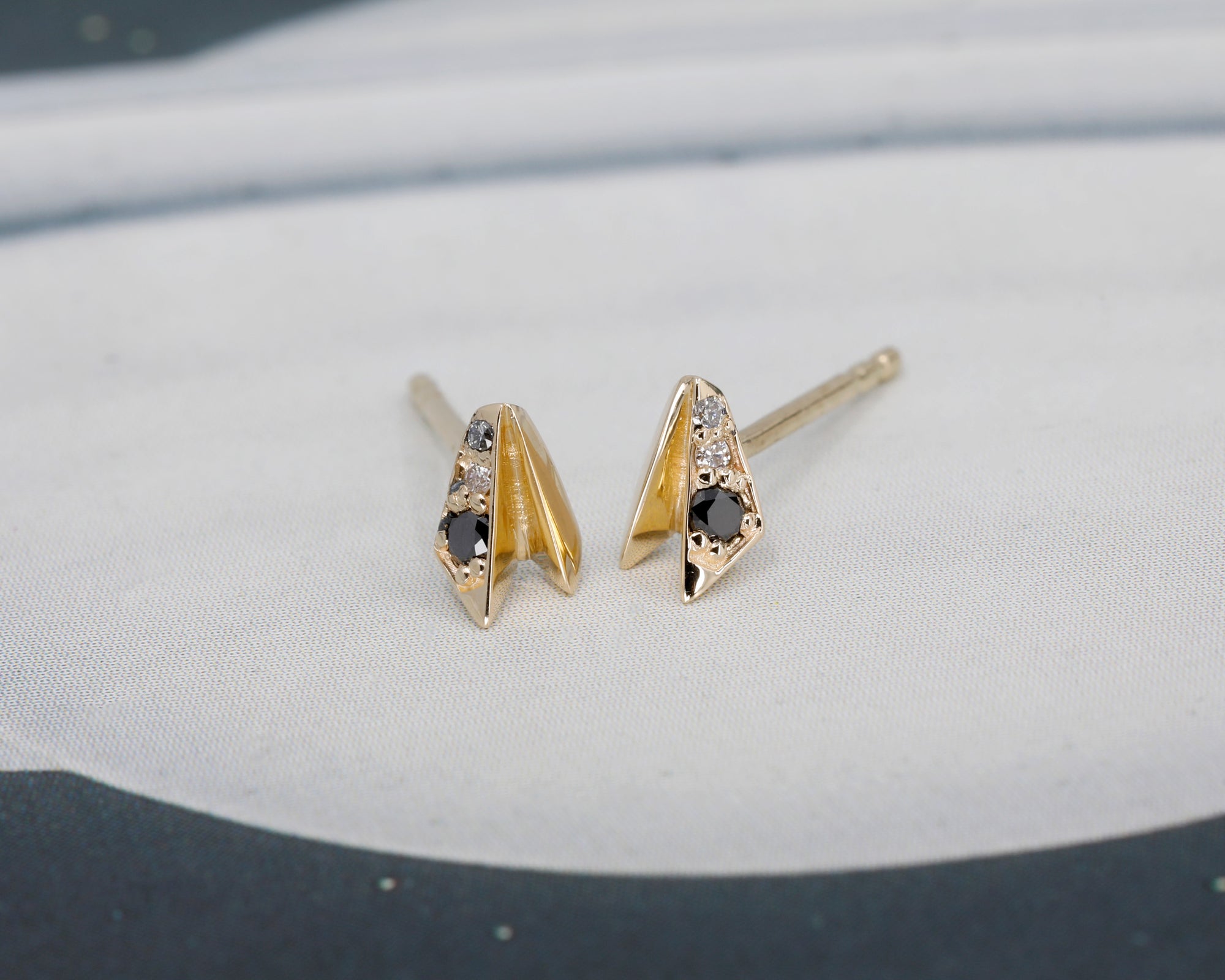 Yellow gold diamond stud earrings in an edgy design, crafted by Canadian designer Bena Jewelry.
