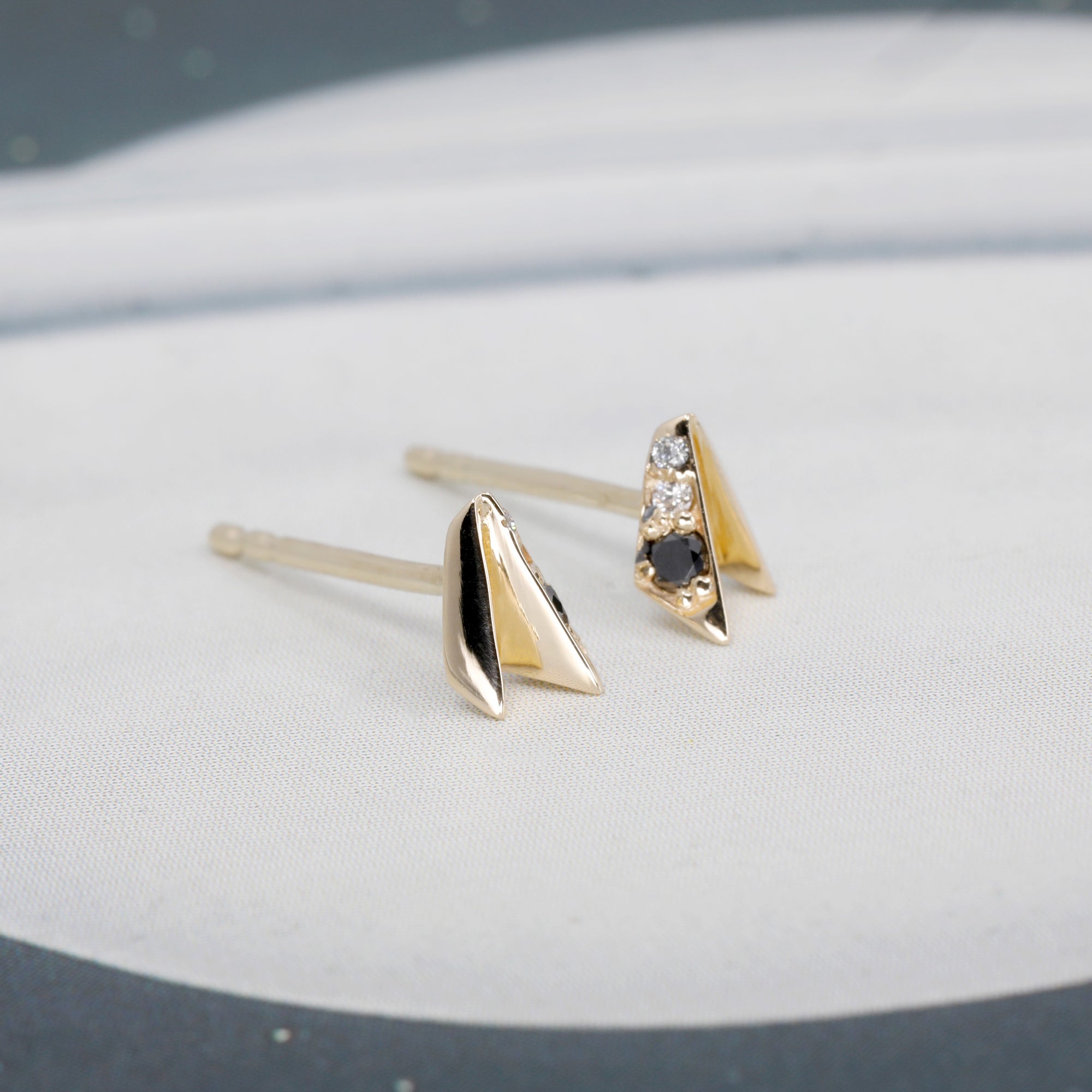 Black and white diamond Edges Studs in yellow gold, worn for a minimalist and bold statement, crafted by Bena Jewelry.