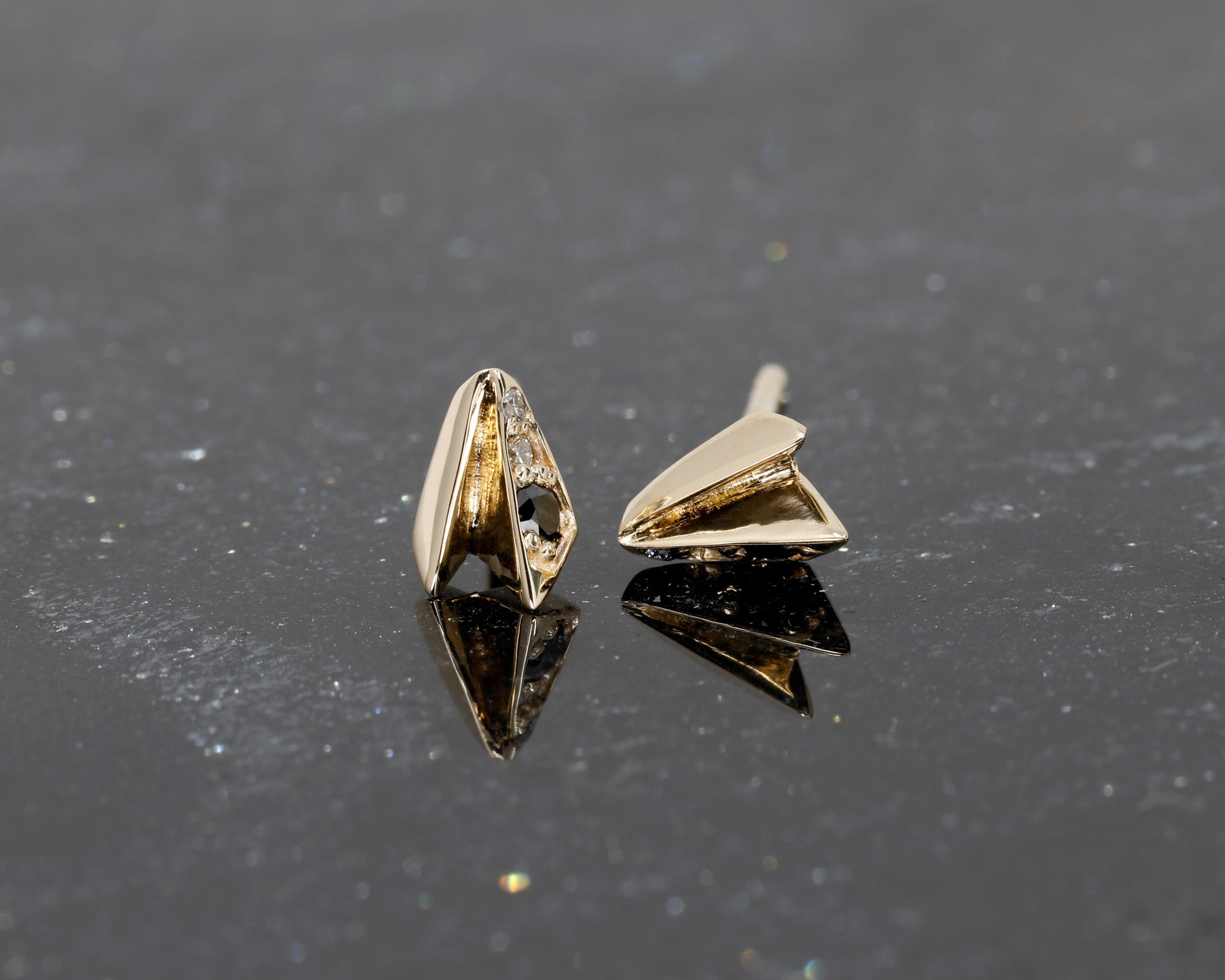 Yellow gold stud earrings with black and white diamonds, part of Bena Jewelry’s edgy jewelry collection made in Canada.