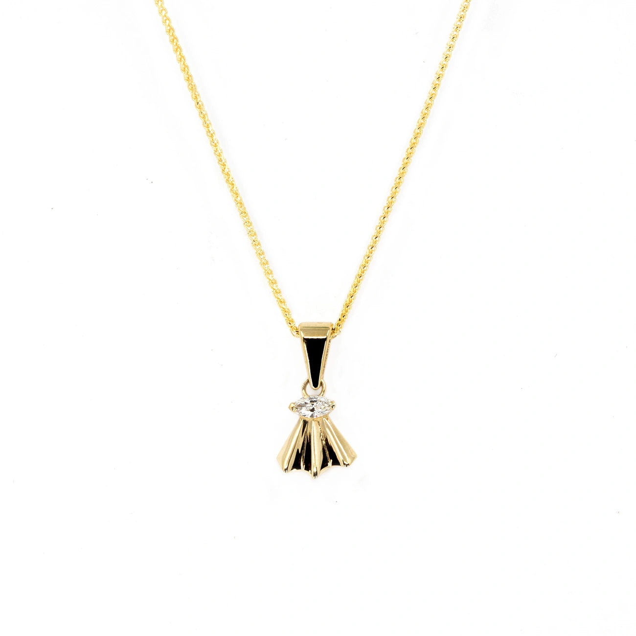 A marquise diamond pendant in yellow gold, showcased on a model. This fan-inspired design from independent local brand Bena Jewelry exudes elegance and timeless sophistication.