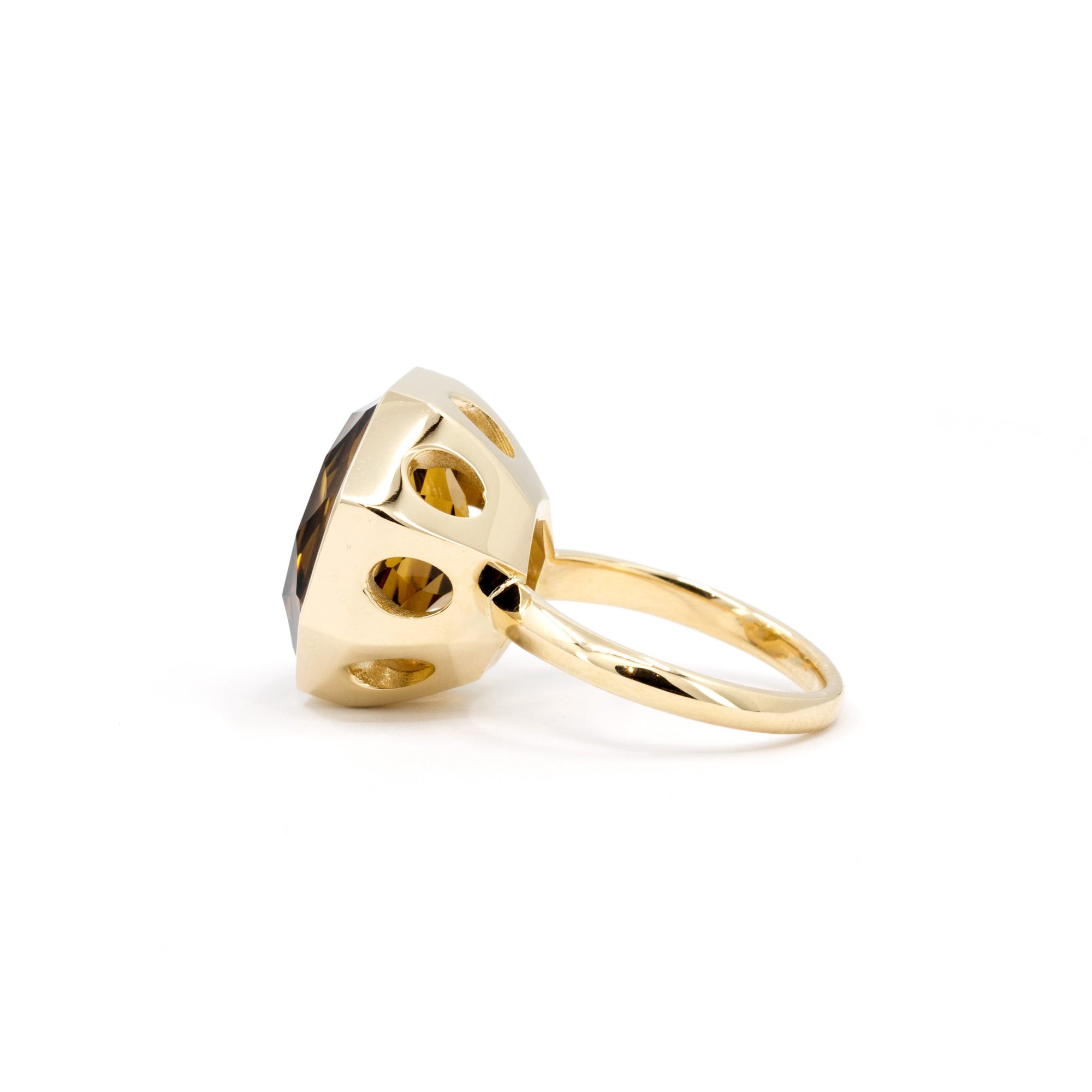 Back view of a large dark orange citrine statement ring, featuring a contemporary bezel setting, displayed on a pristine white background.