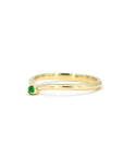 Bold and elegant yellow gold ring with a captivating green Tsavorite gemstone. A refined piece of jewelry designed for those with a taste for luxury and distinctive style.