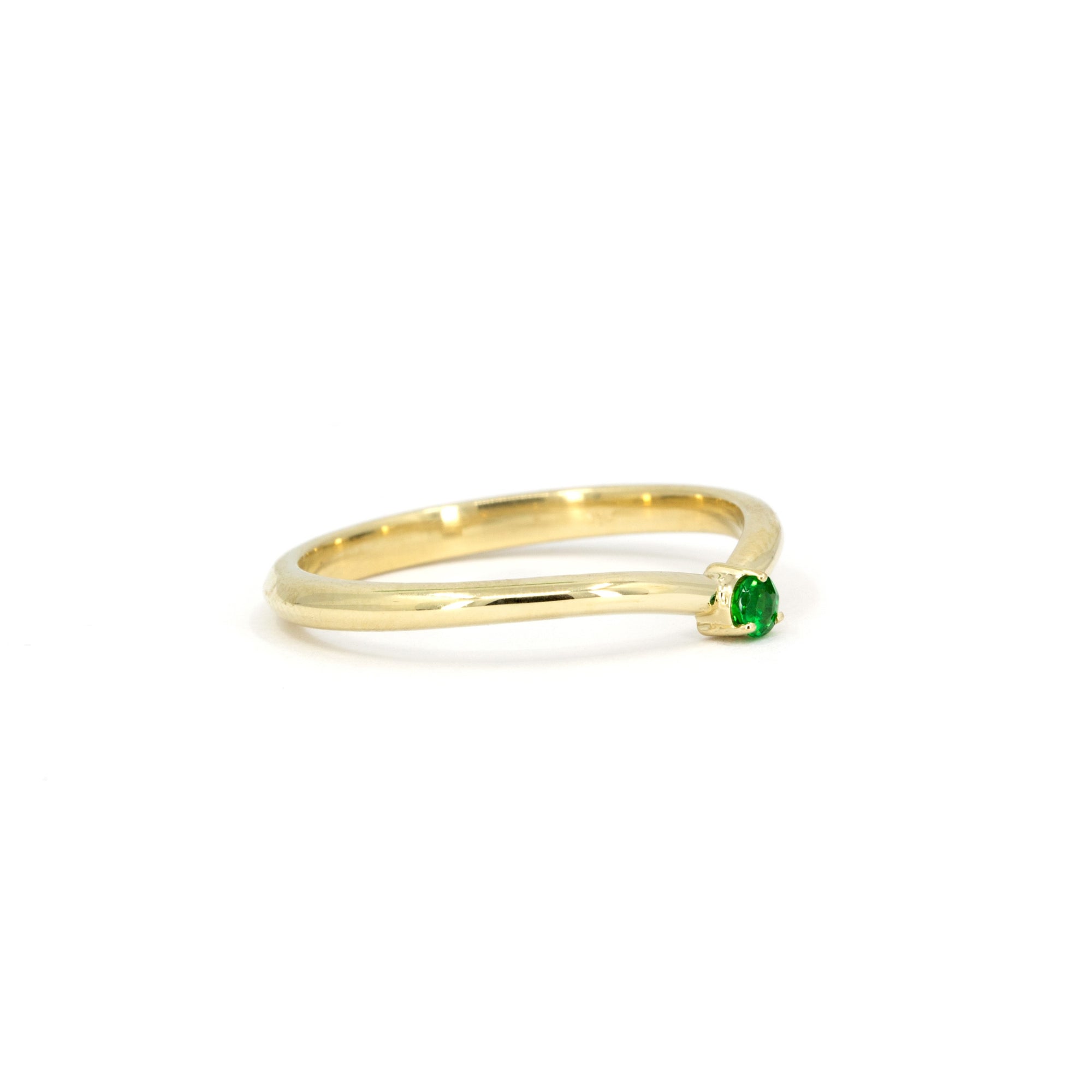 Stunning yellow gold Tsavorite ring with a minimalist design, perfect for those who appreciate refined elegance and unique gemstone jewelry. Crafted by Bena Jewelry.