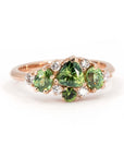 Unique designer ring featuring green sapphire and demantoid garnet gemstones, set in rose gold. Made by Bena Jewelry in Montreal, Canada.