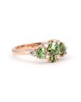 One-of-a-kind ring with green sapphire and demantoid garnets, crafted in rose gold by Canadian designer Bena Jewelry in Montreal.