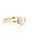 Marquise Diamond and Sapphire Ring in yellow gold by Bena Jewelry, featuring a unique design with diamond accents and vivid sapphires, photographed on a clean white background.