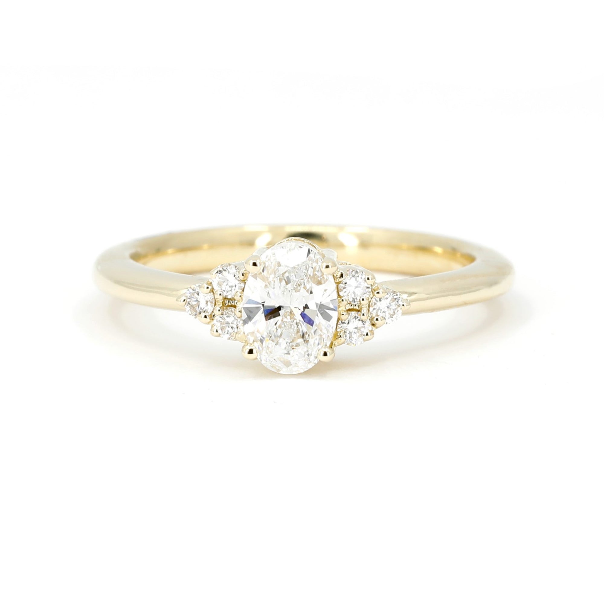 front view of oval shape lab grown designer engagement ring custom made by bena jewelry montreal on white background