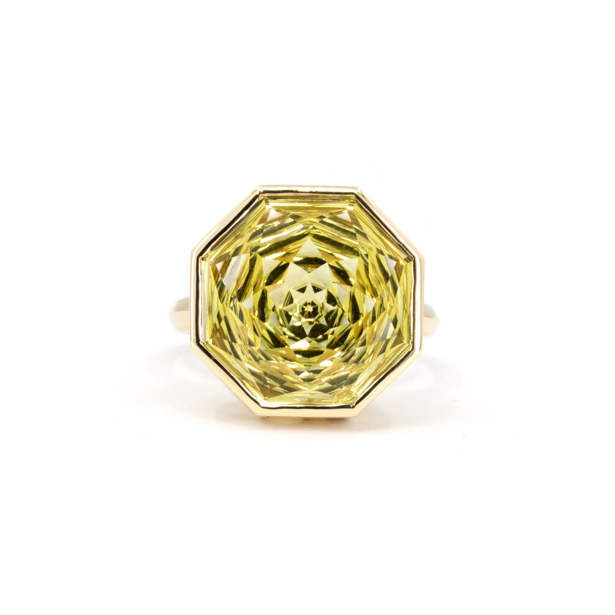 Lemon quartz cocktail ring with an octagonal cut, bezel-set in yellow gold, beautifully displayed on a white background.