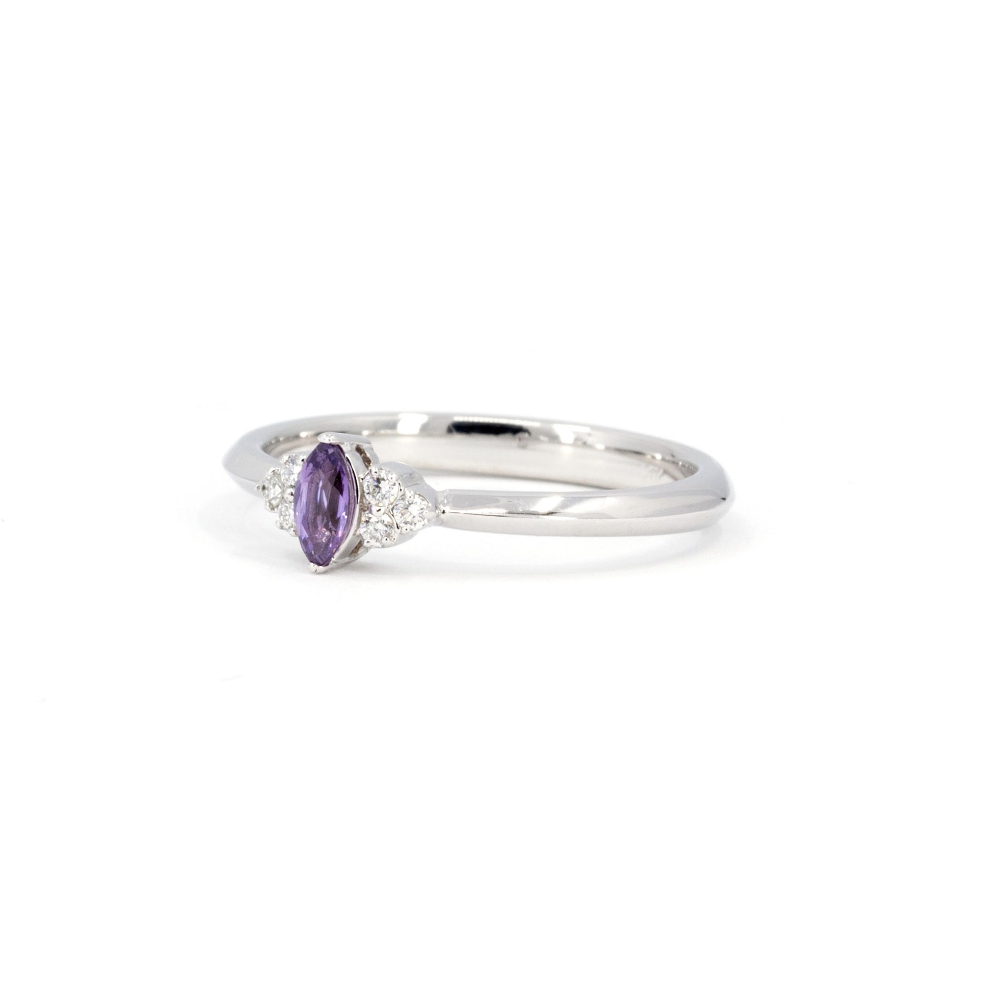Désir Ring styled as a delicate bridal piece, made in Canada – A modern yet timeless design, featuring a vibrant purple sapphire.