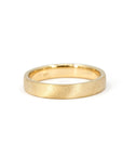 Close-up of the custom-made matte wedding ring, designed with a modern satin finish.