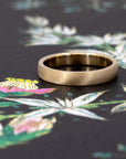Custom yellow gold wedding band with a matte finish, a timeless men’s ring handmade in Montreal.