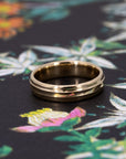 Side view of the Evergold Wedding Band, made in Canada – A refined gold ring with a subtle central line, crafted for everyday elegance. Made by the bridal jewellery designer from Montreal, Bena Jewelry.