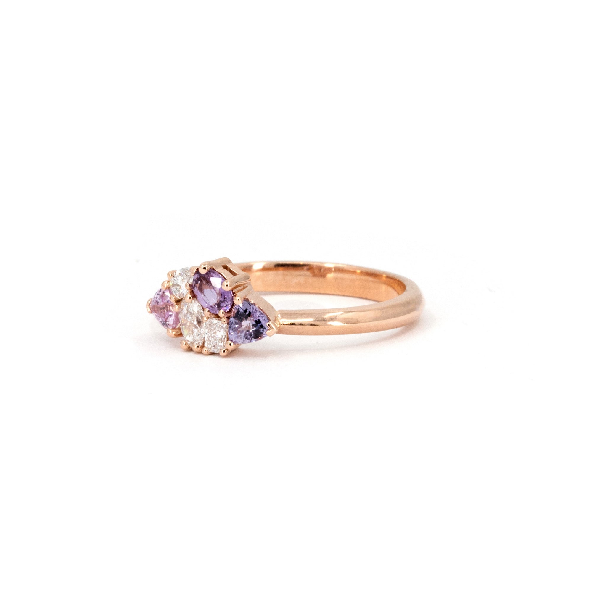 Avalanche ring by Bena Jewelry worn on hand, featuring pink and purple sapphires and diamonds in 14 kt rose gold, designed in Montreal.