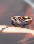 Close-up of the Avalanche ring’s vibrant pink and purple sapphires with sparkling diamonds, set in 14 kt rose gold by Bena Jewelry.
