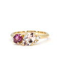Close-up of Tracy ring showing pink morganite, purple rhodolite, and white diamond set on yellow gold.