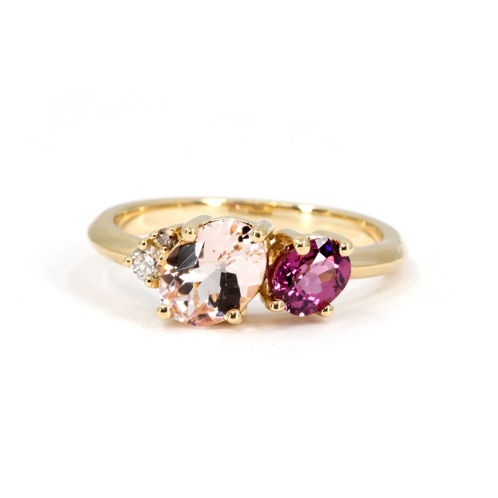 Trio ring in yellow gold with morganite, rhodolite garnet, and diamond, designed by Bena Jewelry, handmade in Montreal, Canada.