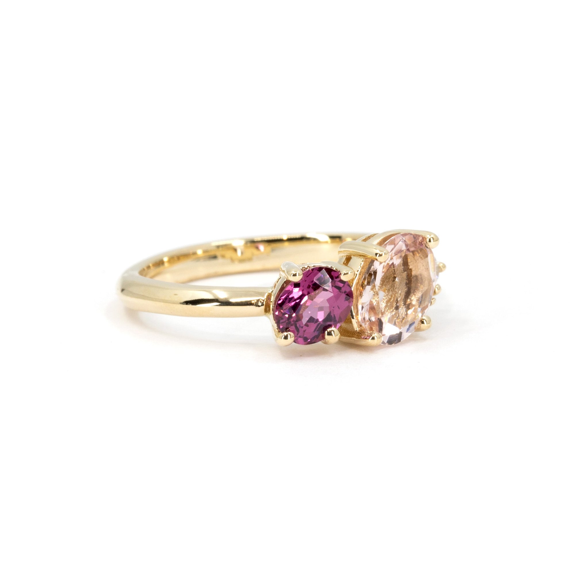 Side angle of yellow gold ring featuring three stones by Bena Jewelry, fine Canadian jewelry.