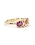 Side angle of yellow gold ring featuring three stones by Bena Jewelry, fine Canadian jewelry.