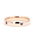 Multi Colored Gemstone Band in rose gold featuring vibrant gemstones in bezel settings by Bena Jewelry photographed on a clean white background custom-made in Montreal