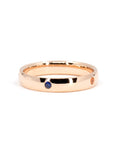 Unique men's wedding band crafted in rose gold with bezel-set colored gemstones by Bena Jewelry photographed on a white background bespoke jewelry from Montreal