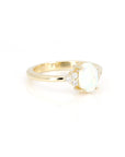side view of diamond and opal engagement ring custom made in montreal by bena jewelry on white background