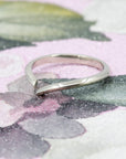 Sleek Gap Ring in white gold, displayed on a soft-colored background. The open design and polished finish highlight its modern, minimalist aesthetic. Handmade in Montreal by Bena Jewelry.