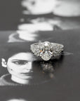 front view of oval shape lab grown diamond and maquise shape pear side gemstone made in montreal by bena jewelry in collaboration with boutique ruby mardi finest jeweler in canada on back background