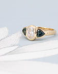 Front view of the Oval Diamond and Teal Sapphire Ring by Bena Jewelry – A modern engagement ring with a sleek bezel setting, designed and crafted in Montreal by an independent Canadian jewelry designer.