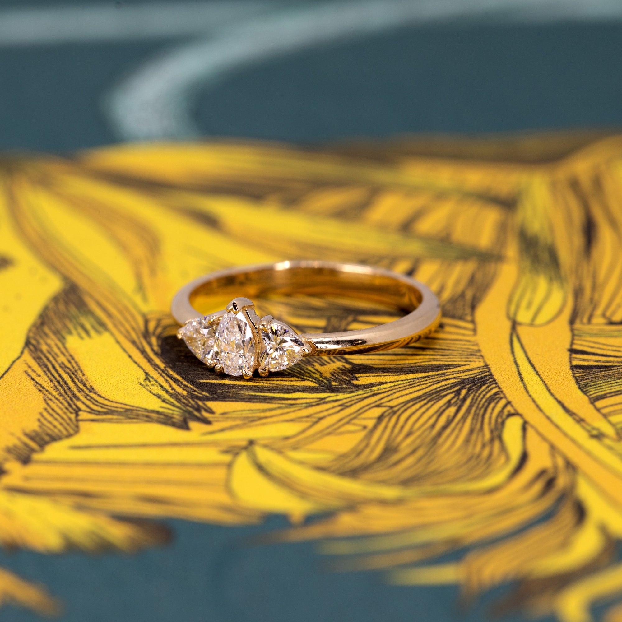 Custom pear and heart diamond ring in yellow gold, an exquisite engagement ring made in Montreal, Canada.