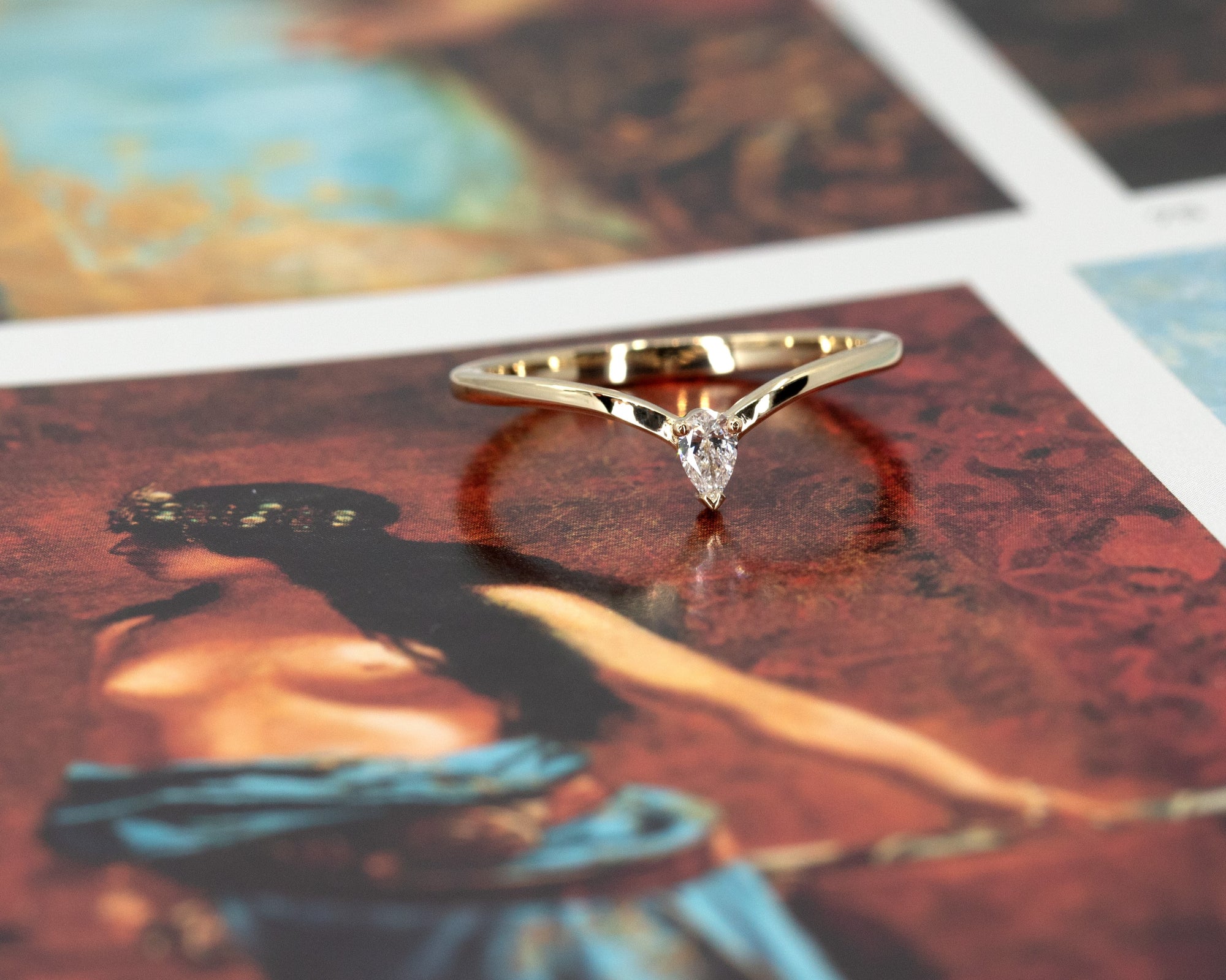 Minimalist ring with a pear-shaped lab-grown diamond worn in a stack, highlighting its delicate design and robust structure. Handcrafted by Bena Jewelry in Montreal, perfect for layering or wearing solo.