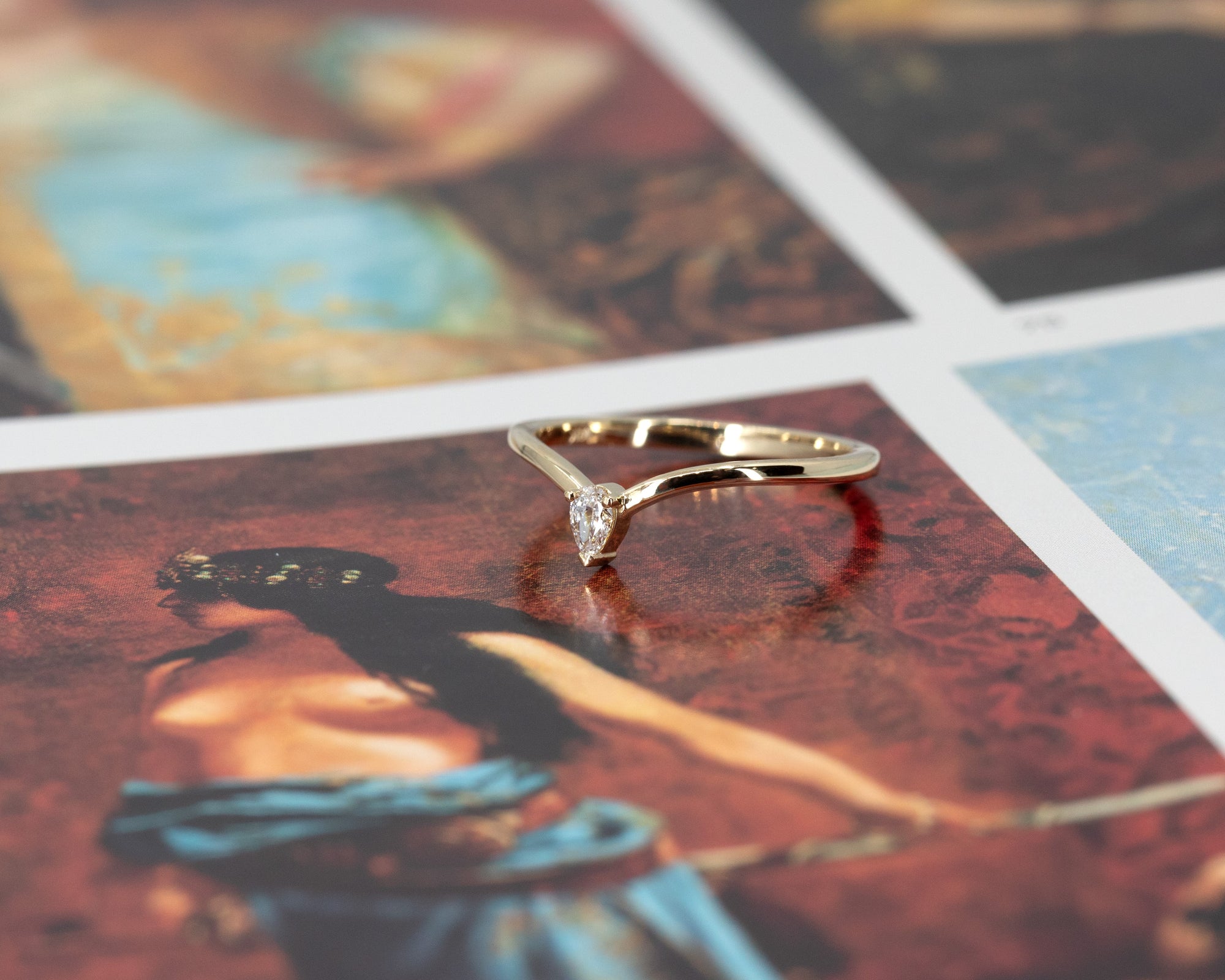 Close-up of the minimalist ring showcasing the pear-shaped lab-grown diamond and the subtle curve on the band. A delicate yet robust design, handcrafted by Bena Jewelry in Montreal.
