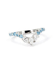Close-up of the pear-shaped white diamonds at the center of the curved platinum band, handmade in Montreal.